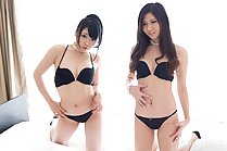 Girls kneeling on bed wearing bra and panties