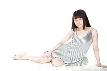 Araki Mai seated wearing striped dress high heels